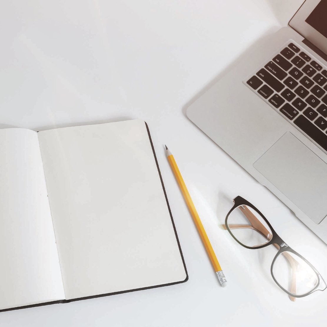 Laptop, notebook, pencil, and glasses